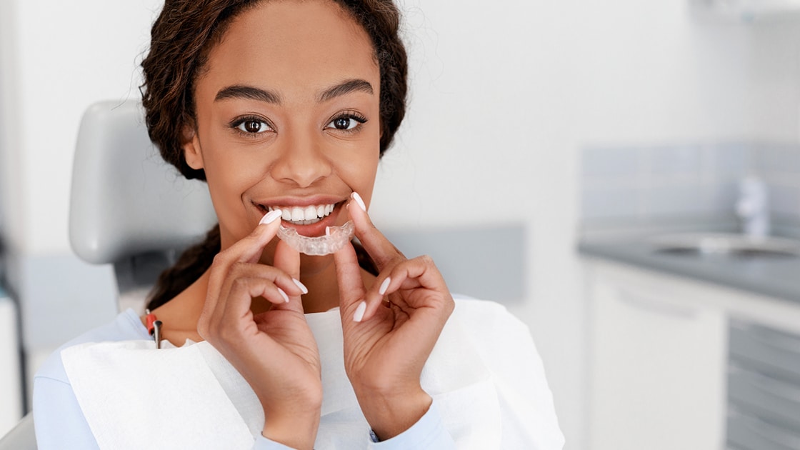 woman putting in clear alignment