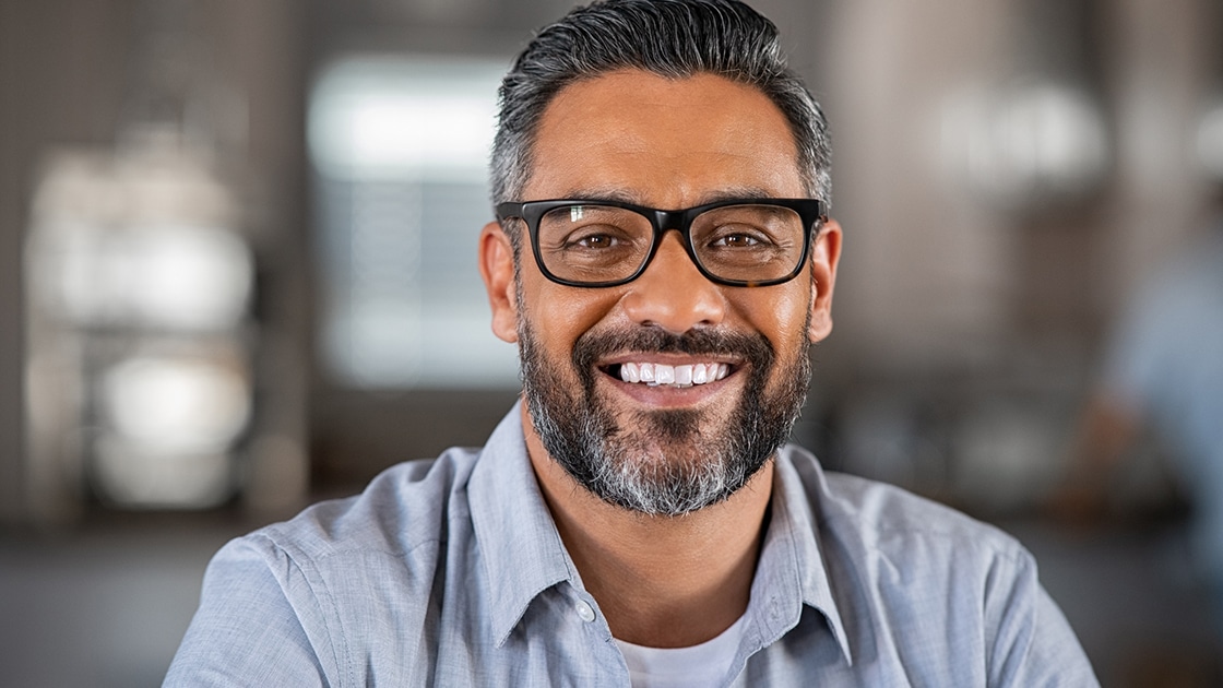 Man smiling with restorative teeth